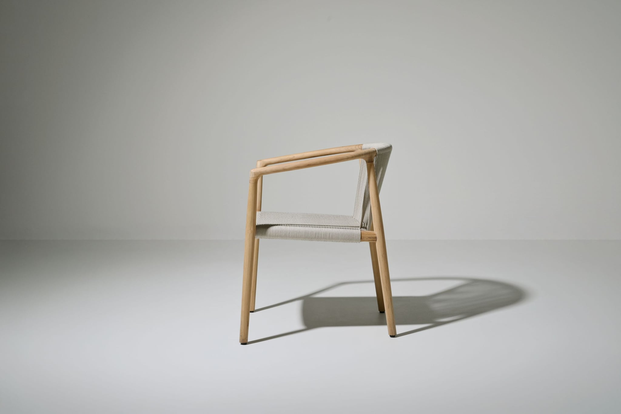 Royce teak dining armchair